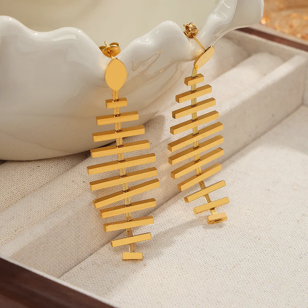 Golden Fishbone Statement Earrings - Unique Metal Design Jewelry from Planderful Collection