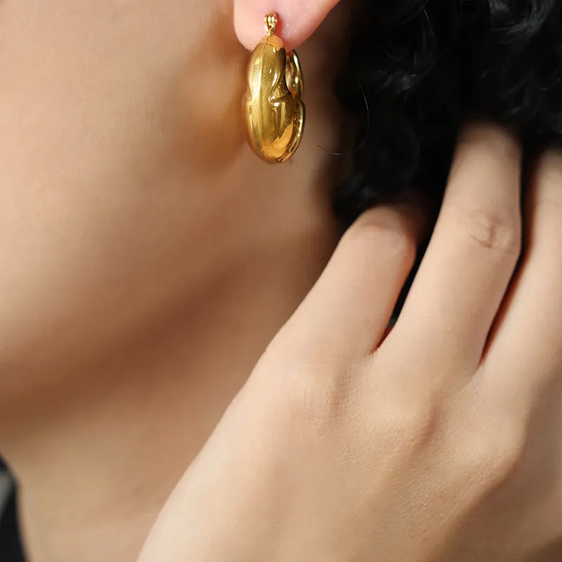 Golden Geometric High-Fashion Earrings with Unique Design