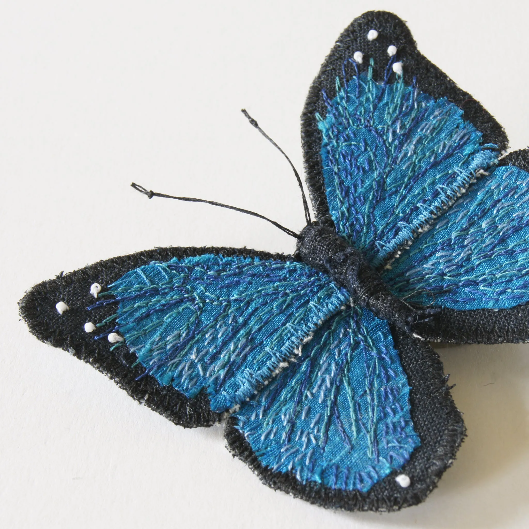 Menelaus blue morpho fiber art brooch