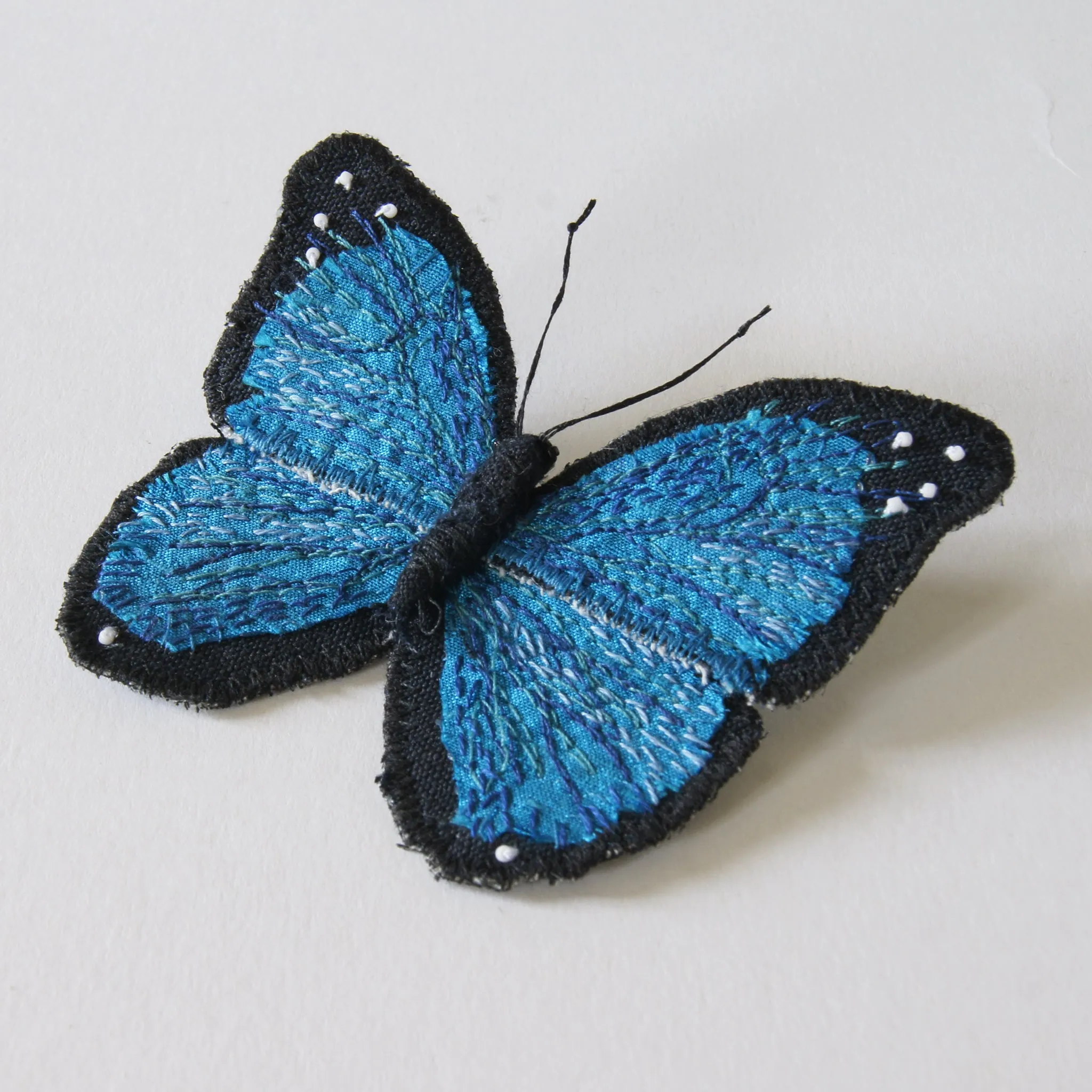 Menelaus blue morpho fiber art brooch